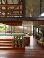 Decked area and pool outside modern home