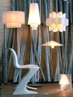 Modern chair surrounded by modern lamps