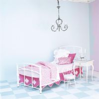 Childrens bedroom with bed and chandelier
