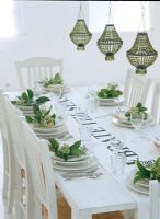 Place setting on dining table with wine glasses