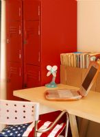 Childrens room with laptop on desk and school locker storage