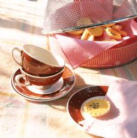 Tea cups with cookies on table