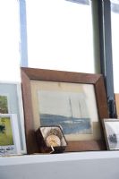 Framed photographs and collectibles on shelf