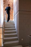 Man walking up modern staircase 