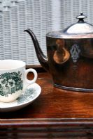 Detail of teapot and cup and saucer