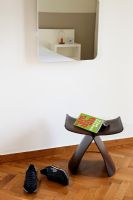 Stool and shoes on parquet floor