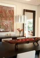 Modern dining room with a boat shaped platter holding fruit