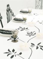 Place setting on dining table with glasses