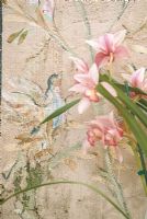 Close-up of flowers against wallpaper