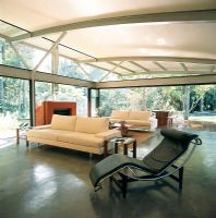 Spacious modern living room with Le Corbusier chaise lounge
