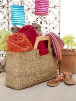 View of towel in basket beside footwear