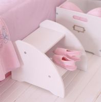 Pink footwear on shelf in a pink room