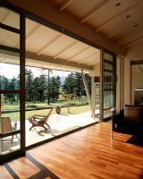 Open sliding glass doors leading to a patio