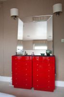 Red chest of drawers in bedroom