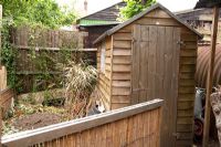Wooden shed in garden 