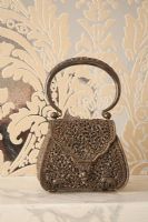 Miniature handbag on mantelpiece