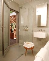 A contemporary bathroom with a glass shower