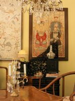 Dining room with ethnic furniture and art