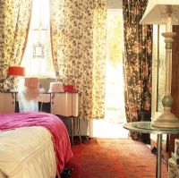 Floral patterned curtains in a bedroom 