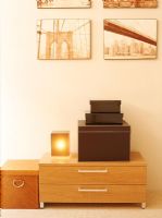 Storage boxes on bedside table