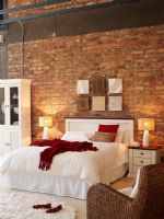 Luxury bedroom with brick wall 