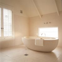 Spacious modern bathroom with large bathtub