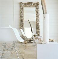 Stones and shells reflected in mirror