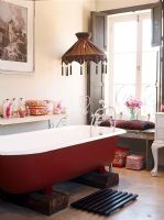 Bathroom with red bath tub
