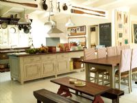 Country style kitchen with dining tables for adults and children