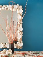 Marine themed tablecloth and shell framed mirror