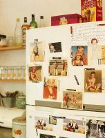 Photographs on refrigerator in kitchen