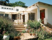 Home facade with patio and garden