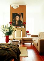 A contemporary living room with a painting 