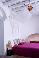 Bedroom with fabric canopy