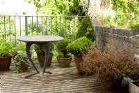 Small decked balcony with table