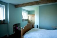 Country style bedroom with blue walls