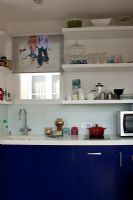 Contemporary kitchen with navy units