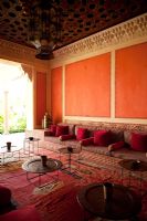 Red living room with moroccan decor