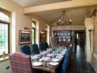 Modern dining room with tartan chairs