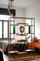 Decorative metal shelves in modern bedroom