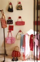 Display of handbags on bedroom wall