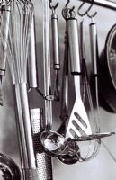 Close up of hanging kitchen utensils