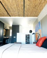 Contemporary bedroom with bamboo ceiling