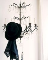 Hat hanging on chandelier 