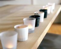Row of tea light candles in holders 
