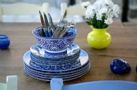 Blue and white crockery on dining table 