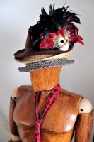 wooden mannequin wearing hats 