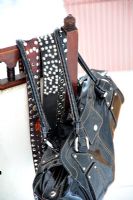 Belts and bag on chair