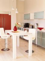 Modern dining table and chairs in kitchen 
