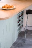 Modern kitchen unit with built-in wine rack